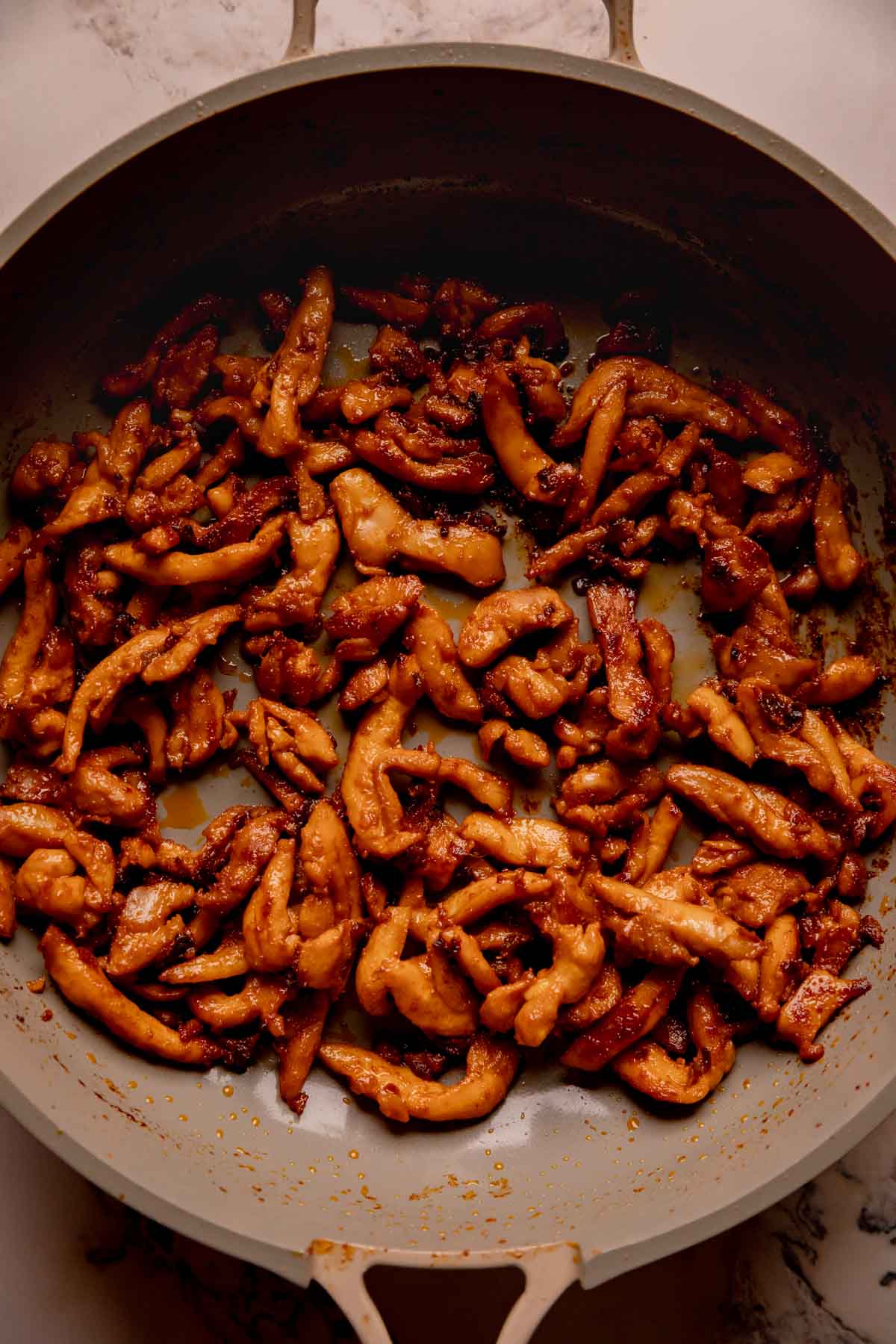 A pan of cooked and caramelized chicken bulgogi.