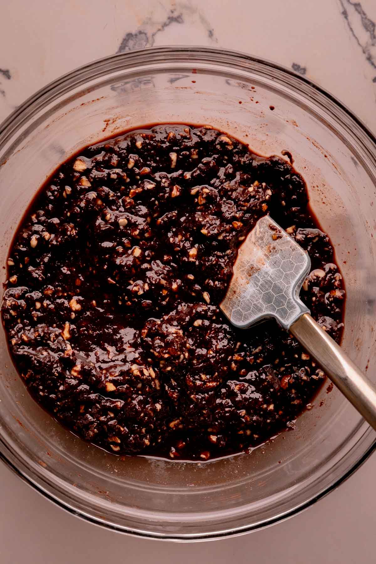 Chocolate butter mixture with ground almonds in a bowl.