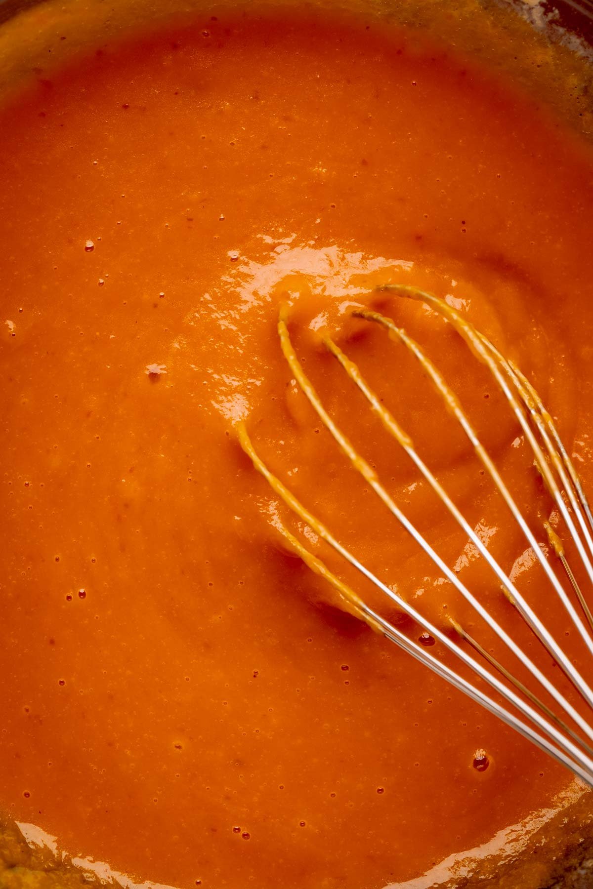 Wet ingredients whisked together in a bowl.