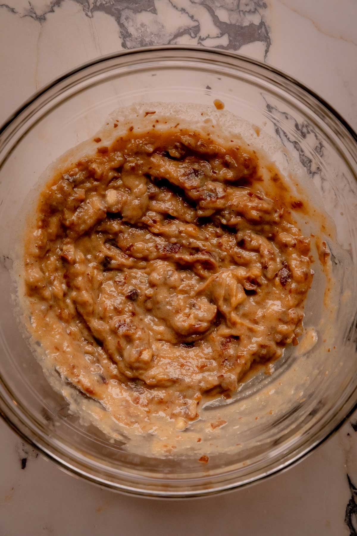 Pasty, mashed dates in a bowl.