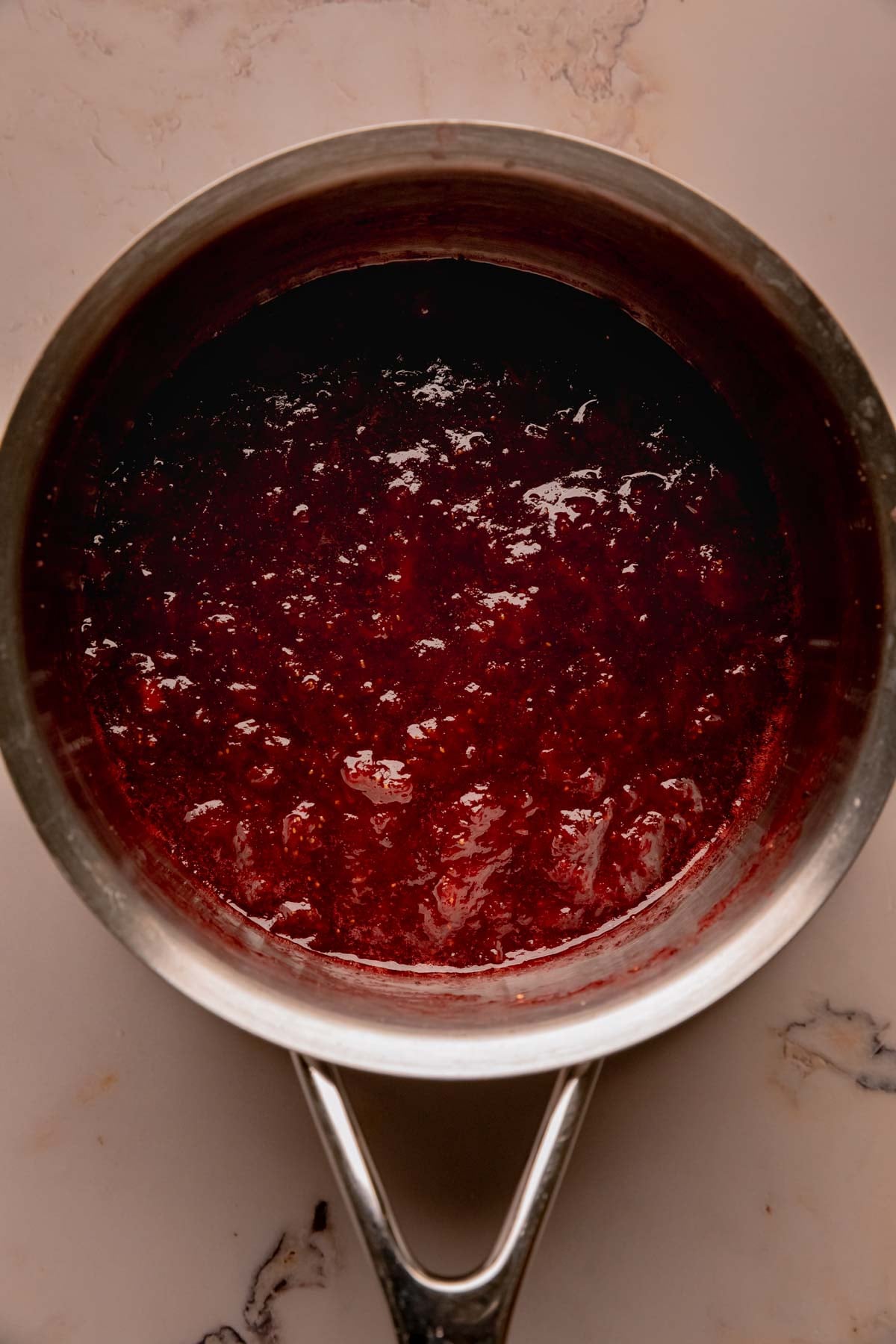 Strawberry sumac jam in a saucepan.