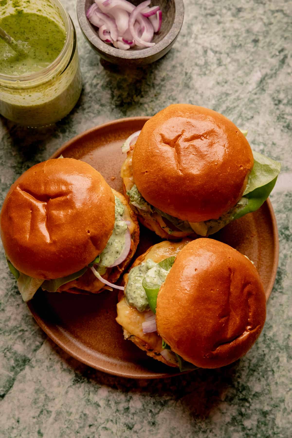 Herbed Chicken Burgers with Spicy Green Goddess Sauce.