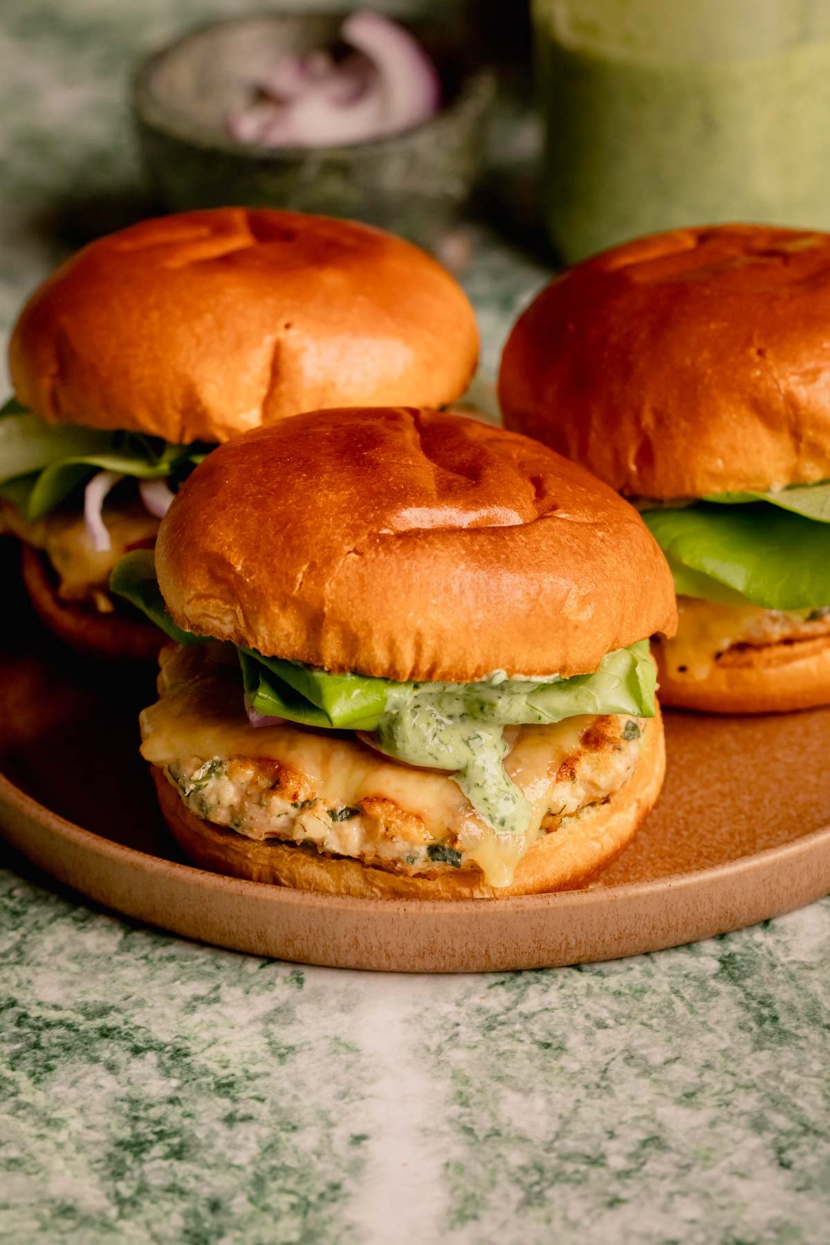 Herbed Chicken Burgers with Spicy Green Goddess Sauce.
