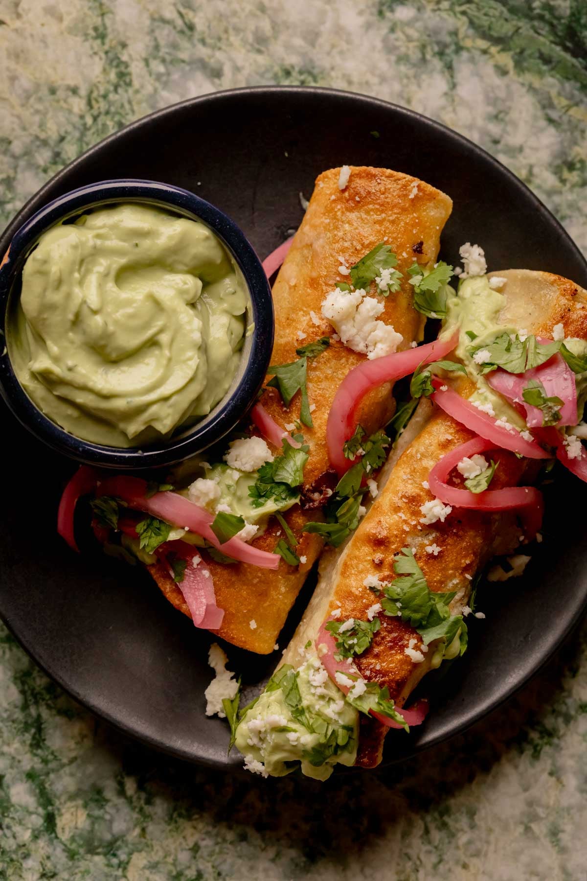 Chipotle Black Bean Flautas with Avocado Crema.